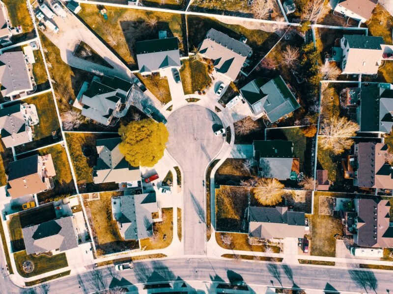 Aerial view of a suburban cul-de-sac ringed by single-family homes.